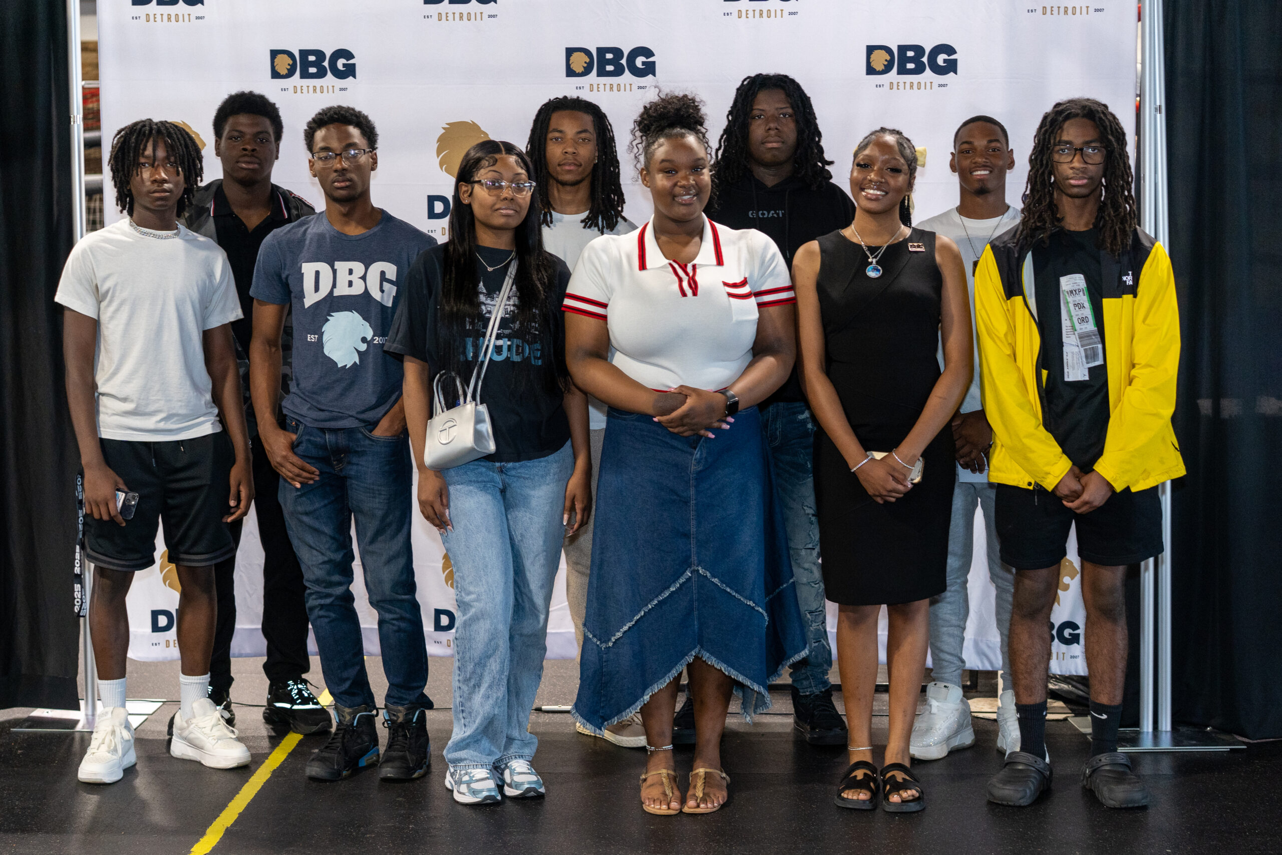 Ten graduating seniors photographed in front of a DBG step and repeat
